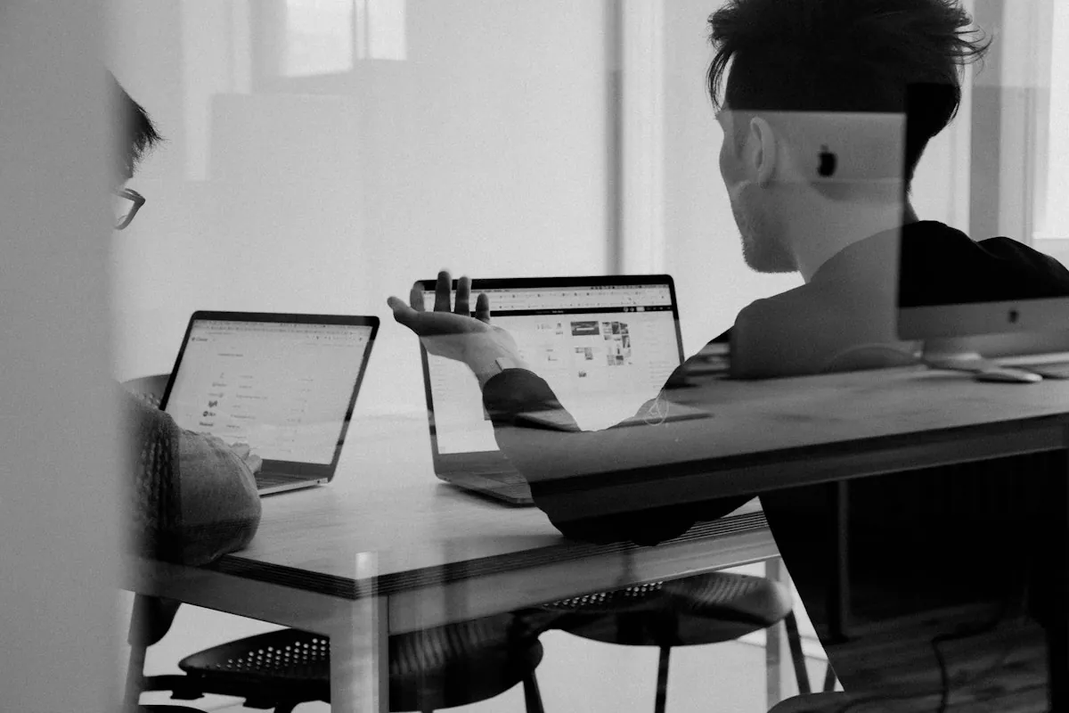 Project team discussing plans around a table